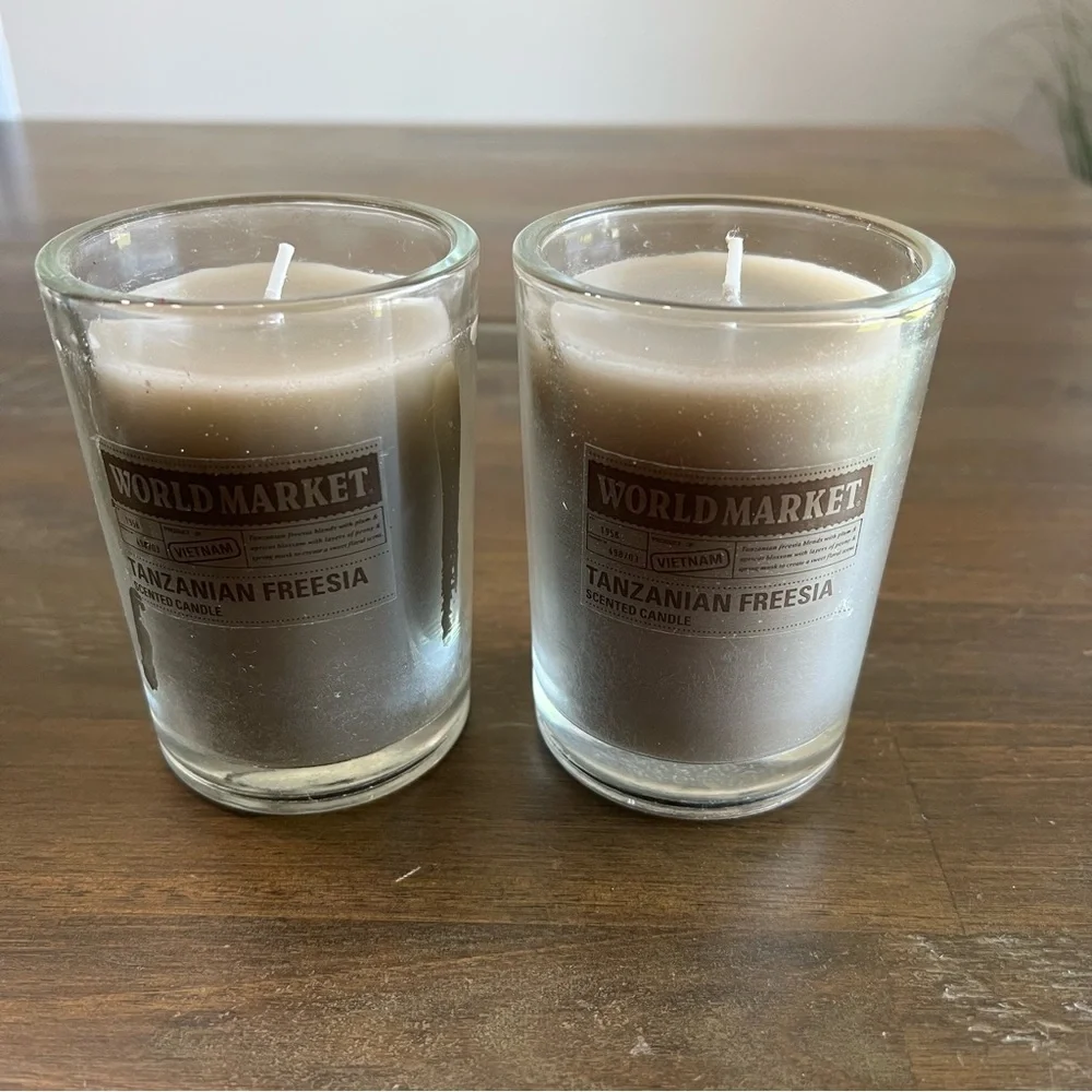 Cost Plus World Market gray Tanzanian Freesia scented candles. Set of 2 3in x 4